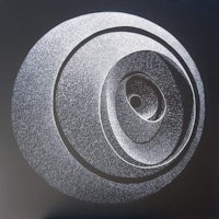 a black and white drawing of a circular object