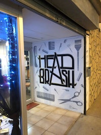 a shop with a sign that says head brush